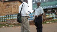 Ugandan Pastor Arrested, Chained to Tree by Police For Giving Away Gospel Film on Street Ugandan Pastor Arrested, Chained to Tree by Police For Giving Away Gospel Film on Street