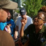 Jesse Boyd of Full Proof Gospel Ministries listens as an Obama supporter shares her views.