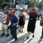 A man dressed as the devil and others sing and dance in the streets.