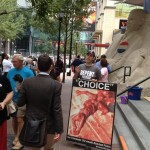Michael Marcavage of Repent America preaches near a 15-ton Obama sand statue.