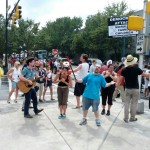 Protesters sing and dance for their cause.