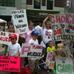 The Wilson family stands up for life outside of Tuesday's Planned Parenthood rally.