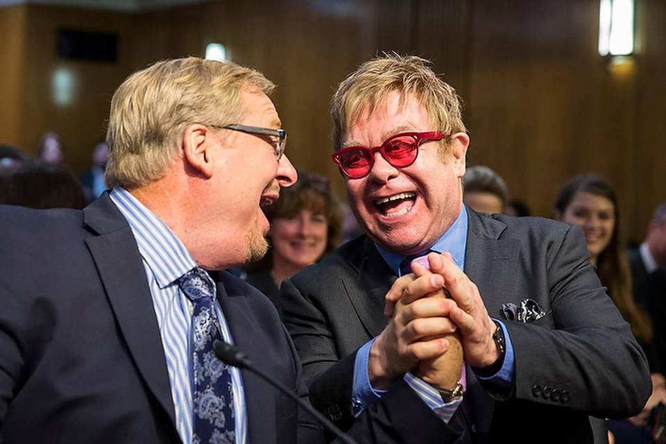 Rick Warren Holds Hands with Elton John