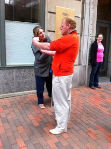 Leslie Sneddon talks to a man who stops to observe the outreach.