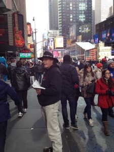 Adams preaches to the crows in Times Square.