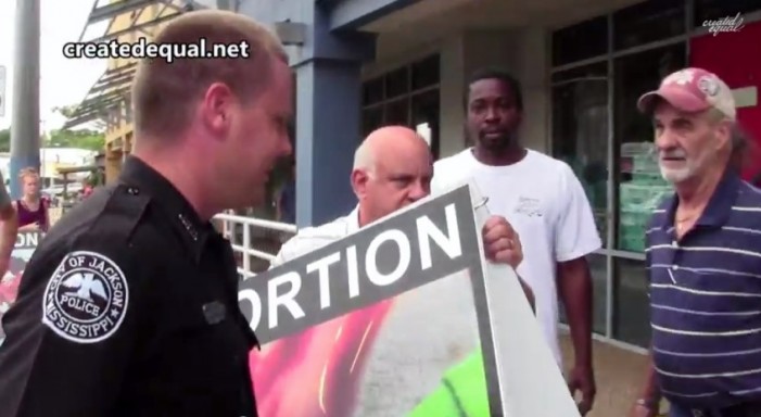 Police Watch Idly as Business Owner Steals Pro-Life Signs from Public Sidewalk