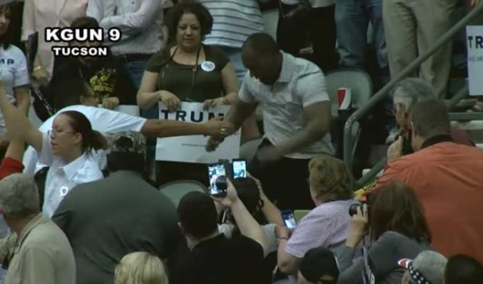Trump Supporter Caught on Video Punching Man in Face at Rally