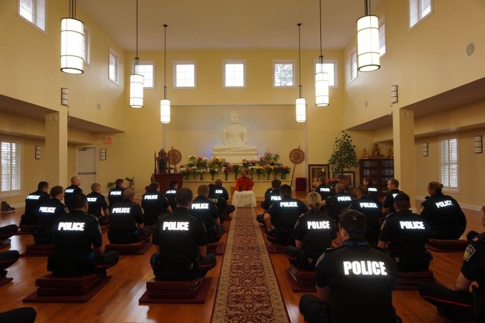 Canadian Police Officers Practice Meditation in Buddhist Temple as Part of Training