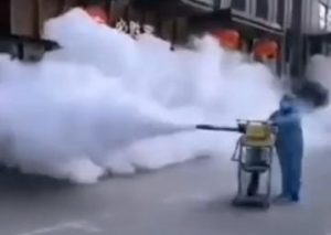 Sanitation workers spraying streets to disinfect from coronavirus
