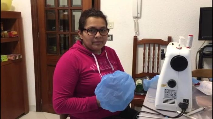 Women From Evangelical Church in Spain Sew Gowns, Caps for Health Care Workers