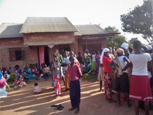 Mourners at the home of the slain Tabiruka Tefiiro in Bupalama village, eastern Uganda. (Morning Star News)